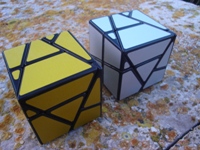 Skewb Ghost Cube (golden and silver).